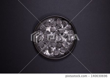 Black pelmeni dumplings with squid ink on plate Black pelmeni dumplings with squid ink on plate 140630696
