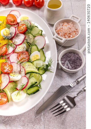 Fresh healthy salad with vegetables and quail eggs Fresh healthy salad with vegetables and quail eggs 140630720