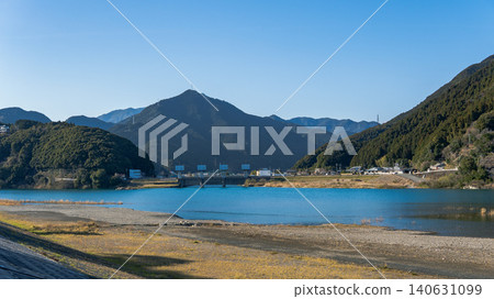 Mount Konotoyama and Ayuta Water Gate as seen from Gongen-gawara on the Kumano River / Shingu City, Wakayama Prefecture, Japan Mount Konotoyama and Ayuta Water Gate as seen from Gongen-gawara on the Kumano River / Shingu City, Wakayama Prefecture, Japan 140631099
