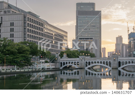 A view of the city and bridge at sunrise. A view of the city and bridge at sunrise. 140631707