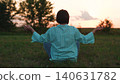 Young woman do yoga sitting green lawn, man meditating sunset, relaxing outdoors, girl relaxing sunset, yoga meditation, body relaxation technique, spiritual self care, rural summer sunset, stress 140631782