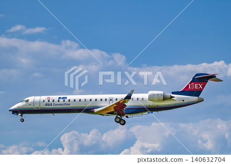 Sendai Airport on a clear day during the rainy season; an airplane landing in Natori City, Miyagi Prefecture. 140632704