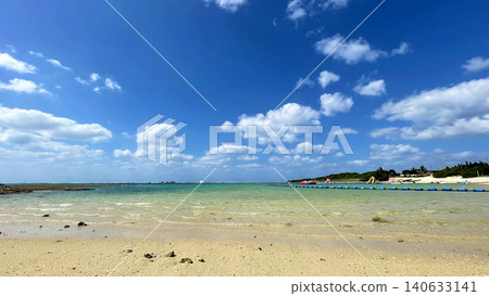 Zanpa Beach: A beach scene with Okinawa's blue sea, white sand, and a vast summer sky. Zanpa Beach: A beach scene with Okinawa's blue sea, white sand, and a vast summer sky. 140633141