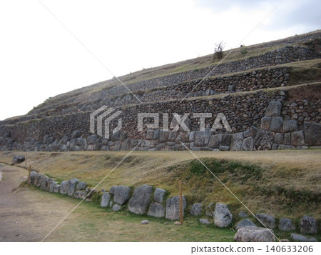 The Sacsayhuamán ruins, with their continuous stepped stonework. The Sacsayhuamán ruins, with their continuous stepped stonework. 140633206