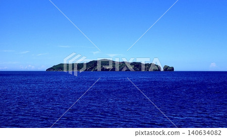 White clouds and blue skies envelop the Bonin Blue sea, and islands. White clouds and blue skies envelop the Bonin Blue sea, and islands. 140634082