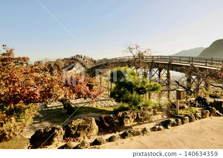 Kintaikyo Bridge and Nomura Maple in Autumn Kintaikyo Bridge and Nomura Maple in Autumn 140634359
