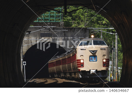 A 485 series "Raicho" limited express train emerges from the Hokuriku Tunnel. A 485 series "Raicho" limited express train emerges from the Hokuriku Tunnel. 140634667