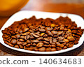 Coffee beans on a white plate. dark background 140634683