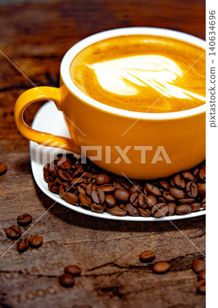 Cup of coffee decorated with a heart and coffee beans transparent dark background Cup of coffee decorated with a heart and coffee beans transparent dark background 140634696