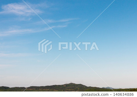 A landscape of blue sky, flowing clouds, and mountain ranges (copy space/background material) A landscape of blue sky, flowing clouds, and mountain ranges (copy space/background material) 140634886