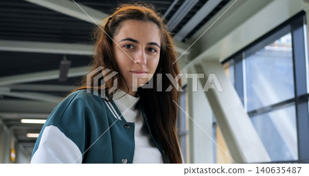 Closeup thoughtful portrait by window, soft natural light on face, serious gaze with subtle expression, varsity jacket collar visible, intimate cinematic mood, authentic youthful presence Closeup thoughtful portrait by window, soft natural light on face, serious gaze with subtle expression, varsity jacket collar visible, intimate cinematic mood, authentic youthful presence 140635487