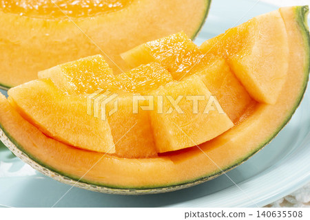 Freshly sliced yellow melon, with its refreshing flesh shining through. Freshly sliced yellow melon, with its refreshing flesh shining through. 140635508