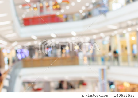 Defocused shopping mall interior bright lights modern retail architecture spacious commercial environment ideal as abstract background for business marketing use Defocused shopping mall interior bright lights modern retail architecture spacious commercial environment ideal as abstract background for business marketing use 140635653