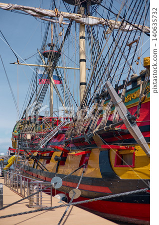 moored replica of an ancient sailing frigate in yacht club in Saint-Petersburg - Russia at clear sunny weather, huge masts, thick ropes 140635732