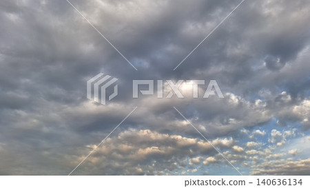 Overcast sky with grey storm clouds and sunset light 140636134