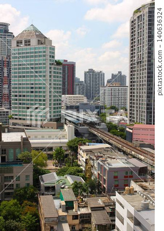 High-rise condominiums towering over the area around BTS Phra Khanong in Bangkok, Thailand, and the cityscape. High-rise condominiums towering over the area around BTS Phra Khanong in Bangkok, Thailand, and the cityscape. 140636324
