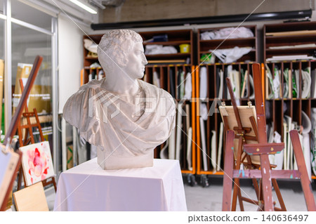 Plaster casts and art supplies in the studio Plaster casts and art supplies in the studio 140636497