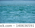 The ripples and textures of the blue ocean reflecting sunlight. 140636591