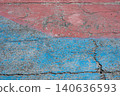 Cracked ground texture painted with red and blue paint. 140636593