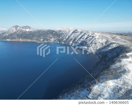 Aerial view of Lake Mashu in Hokkaido in the middle of winter, a fantastical snowscape. Aerial view of Lake Mashu in Hokkaido in the middle of winter, a fantastical snowscape. 140636605