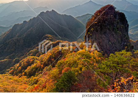 View of Ichinodake and Yotsumatayama from Ninodake in Nishijoshu, amidst the autumn foliage. View of Ichinodake and Yotsumatayama from Ninodake in Nishijoshu, amidst the autumn foliage. 140636622