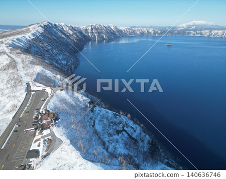 Aerial view of Lake Mashu in Hokkaido in the middle of winter, a breathtaking snowscape. Aerial view of Lake Mashu in Hokkaido in the middle of winter, a breathtaking snowscape. 140636746