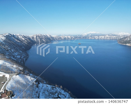 Aerial view of Lake Mashu in Hokkaido in the middle of winter, a fantastical snowscape. Aerial view of Lake Mashu in Hokkaido in the middle of winter, a fantastical snowscape. 140636747