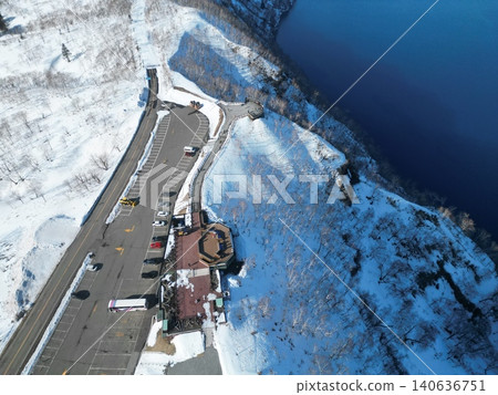 Aerial view of Lake Mashu in Hokkaido in the middle of winter, taken from above the first observation deck. Aerial view of Lake Mashu in Hokkaido in the middle of winter, taken from above the first observation deck. 140636751