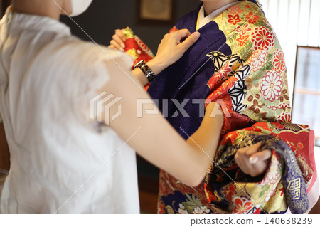 A woman wearing a kimono A woman wearing a kimono 140638239