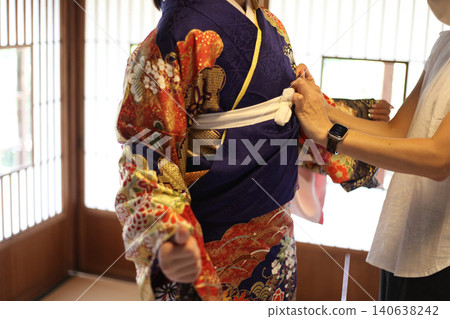 A woman wearing a kimono 140638242