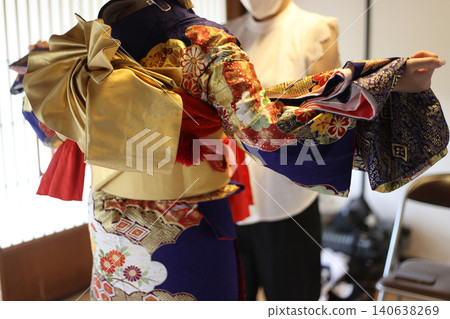 A woman wearing a kimono 140638269