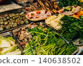 Assortment of fresh local vegetables and ingredients for sale at a Thai market 140638502