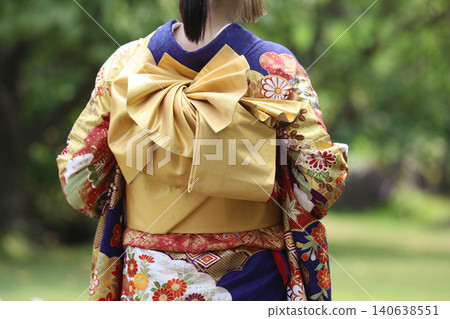 A woman in a kimono A woman in a kimono 140638551