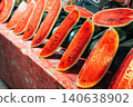 Fresh and juicy sliced red watermelon displayed for sale at a local fruit market 140638902