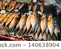 grilled fish displayed for sale at a local street food market 140638904