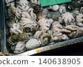 Fresh raw fish displayed on ice for sale at a local seafood market 140638905