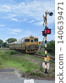 A train passing a level crossing 140639471