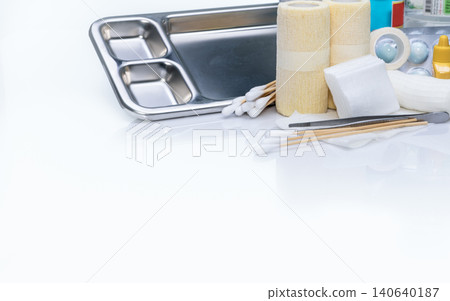 Wound care dressing set. Wound care equipment in hospital for nurse. Conform bandage, forceps, alcohol, cotton sticks, povidone-iodine for infection wound. Medical supply. Medical equipment for nurse. Wound care dressing set. Wound care equipment in hospital for nurse. Conform bandage, forceps, alcohol, cotton sticks, povidone-iodine for infection wound. Medical supply. Medical equipment for nurse. 140640187