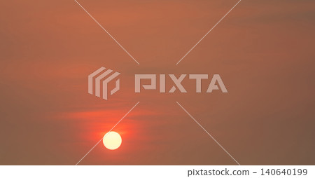 Round big sun and red sunset sky in the evening with space for inspiration quote. Beauty in nature. Beautiful summer sunset sky. Tranquil and peaceful background. Panorama scene of red sky. Round big sun and red sunset sky in the evening with space for inspiration quote. Beauty in nature. Beautiful summer sunset sky. Tranquil and peaceful background. Panorama scene of red sky. 140640199