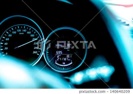 Closeup car fuel gauge dashboard panel. Gasoline indicator meter and speedometer. Fuel gauge show full gas tank. Data information dashboard show outside car temperature, trip range and fuel tank icon. 140640209