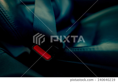 Car seat belt with red press button. Fasten seatbelt for safety and security and protect life from car accident. Buckle up black seat belt for safety. Buckle up seat belt it's the law. Safe road trip. Car seat belt with red press button. Fasten seatbelt for safety and security and protect life from car accident. Buckle up black seat belt for safety. Buckle up seat belt it's the law. Safe road trip. 140640219