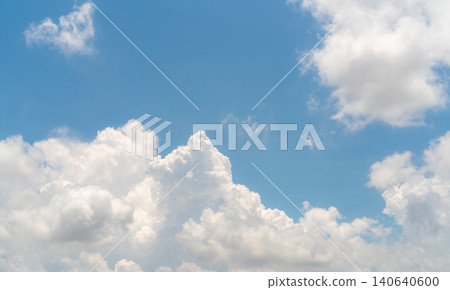 White fluffy clouds on blue sky. Soft touch feeling like cotton. White puffy cloudscape. Beauty in nature. Close-up white cumulus clouds texture background. Sky on sunny day. Pure white clouds. 140640600
