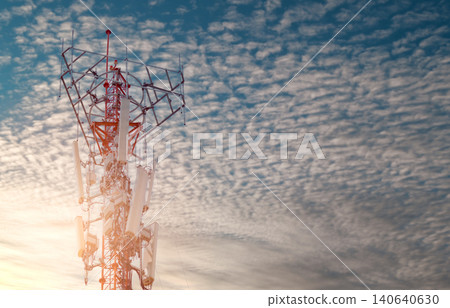 Telecommunication tower with blue sky and white clouds background. Antenna on blue sky. Radio and satellite pole. Communication technology. Telecommunication industry. Mobile or telecom 4g network. Telecommunication tower with blue sky and white clouds background. Antenna on blue sky. Radio and satellite pole. Communication technology. Telecommunication industry. Mobile or telecom 4g network. 140640630