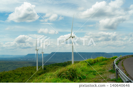Wind energy. Wind power. Sustainable, renewable energy. Wind turbines generate electricity. Windmill farm on a mountain with blue sky. Green technology. Renewable resource. Sustainable development. Wind energy. Wind power. Sustainable, renewable energy. Wind turbines generate electricity. Windmill farm on a mountain with blue sky. Green technology. Renewable resource. Sustainable development. 140640646