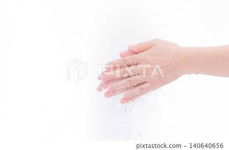 Woman washing hand with water isolated on white background. Good personal hygiene concept. First step to clean dirty hands for prevent flu and coronavirus. Adult woman hand soak and wet with water. Woman washing hand with water isolated on white background. Good personal hygiene concept. First step to clean dirty hands for prevent flu and coronavirus. Adult woman hand soak and wet with water. 140640656