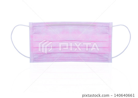 Pink surgical or medical face mask isolated on white background. Surgical face mask for coronavirus protection. Disposable earloop face mask for cover mouth to virus and air pollution protective. Pink surgical or medical face mask isolated on white background. Surgical face mask for coronavirus protection. Disposable earloop face mask for cover mouth to virus and air pollution protective. 140640661
