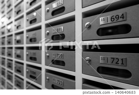 Modern mail box of apartment filled home numbers of resident. Mailbox in a row in letter box office of apartment. Post office and envelope mail delivery business concept. Postbox lock for security. Modern mail box of apartment filled home numbers of resident. Mailbox in a row in letter box office of apartment. Post office and envelope mail delivery business concept. Postbox lock for security. 140640683