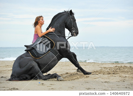 riding girl and horse 140640972