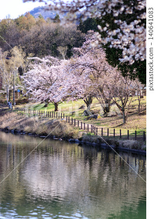 The tranquil shores of Komagaike Pond in spring The tranquil shores of Komagaike Pond in spring 140641083
