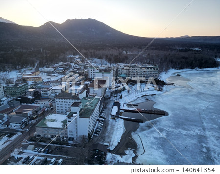Aerial view of the winter scenery of the Akan Onsen hot spring resort area in Kushiro City, Hokkaido. Aerial view of the winter scenery of the Akan Onsen hot spring resort area in Kushiro City, Hokkaido. 140641354